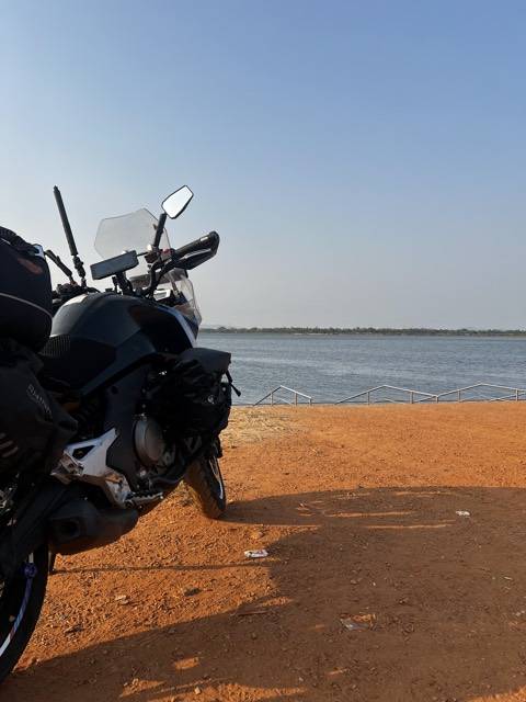 Odisha again, orange sand running down to the water.